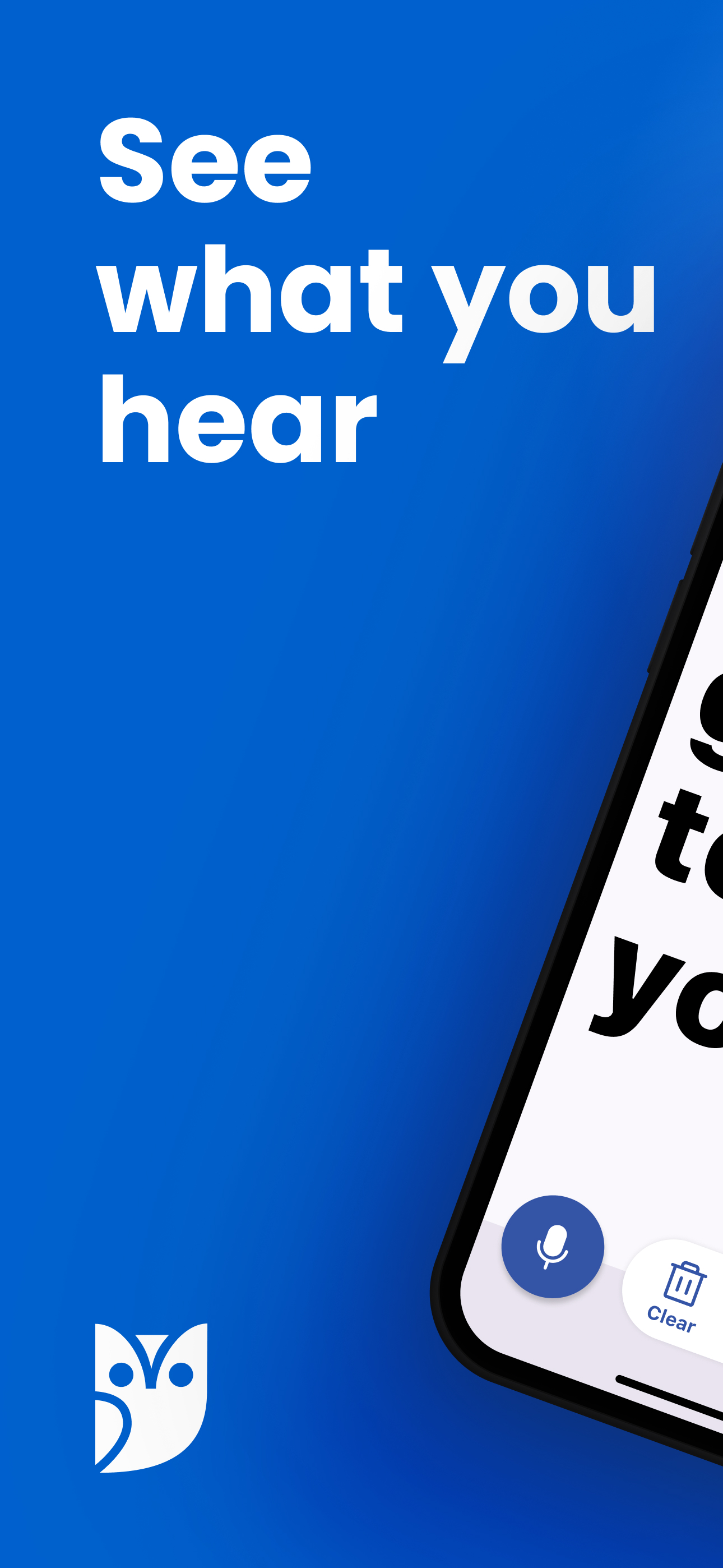 Transcriber home screen with the tagline See what you hear and a large microphone button
